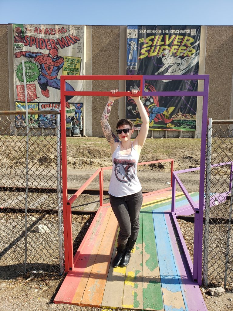 amanja in front of mile high comics