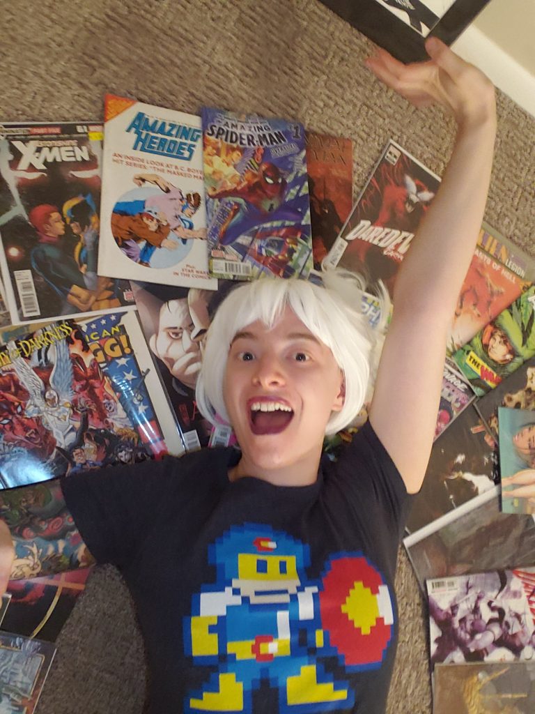 amanja in a pile of comics