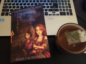 the purest form of chaos on a laptop with tea