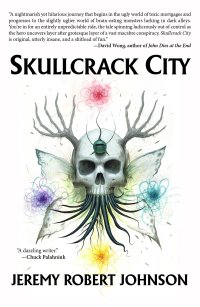 skullcrack city book cover a skull with butterfly wings and hand like antlers surrounded by flowers